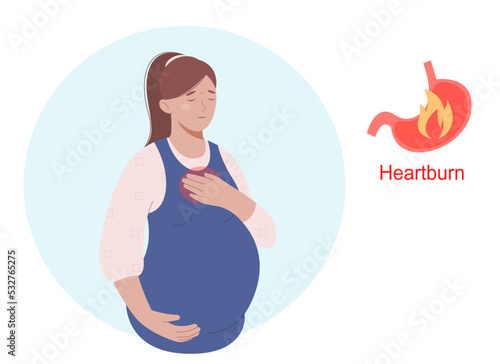Heartburn during pregnancy. Woman holding abdomen and feel pain. Pregnancy symptoms and problems concept. photo
