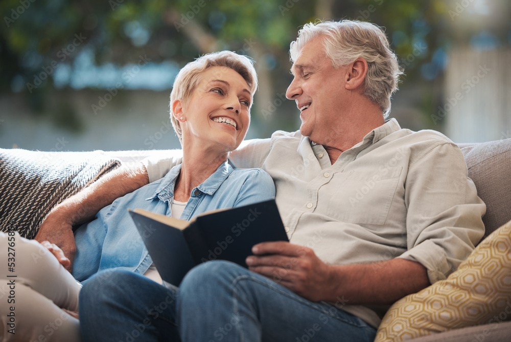 Senior, couple and pension people reading with a happy smile in a home living room sofa. Retirement of elderly man and woman smiling with calm happiness on a house couch with a book together - obrazy, fototapety, plakaty 