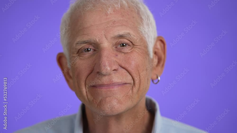 Closeup portrait of a smiling handsome middle aged man 70s. Mature caucasian man showing real emotions being happy, confident and likable. Closeup portrait of a smiling handsome middle aged man 70s. Mature caucasian man showing real emotions being happy, confident and likable.