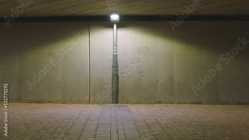 Hip hop, back flip or city man in dance, creative energy movement or grunge art motion at night on road in New York. Fashion, trippy or cool dancer in breakdance stunt by wall background street light