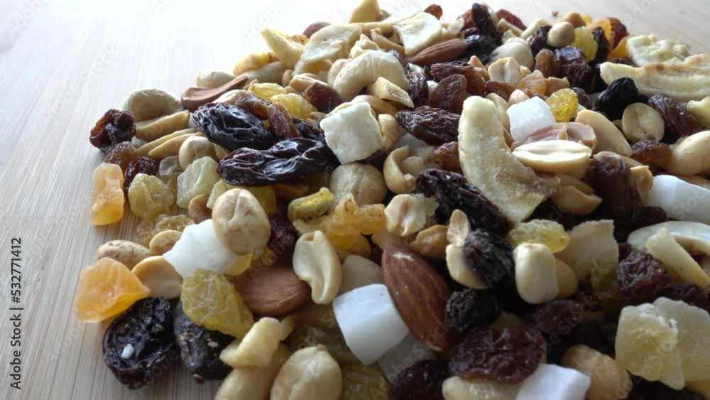 Closeup of Various Sliced Dry Fruits on a Wooden Background. Healthy Food Concept Closeup of Various Sliced Dry Fruits on a Wooden Background. Healthy Food Concept