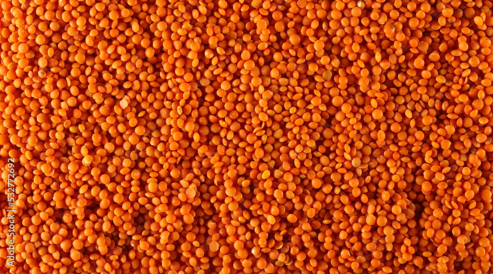 Red lentils uncooked background and texture 