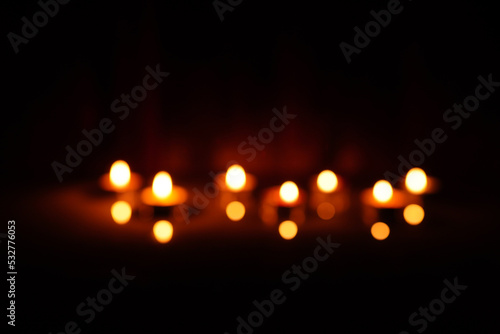 candle giving light orange close-up Blurred or blurry, dark back