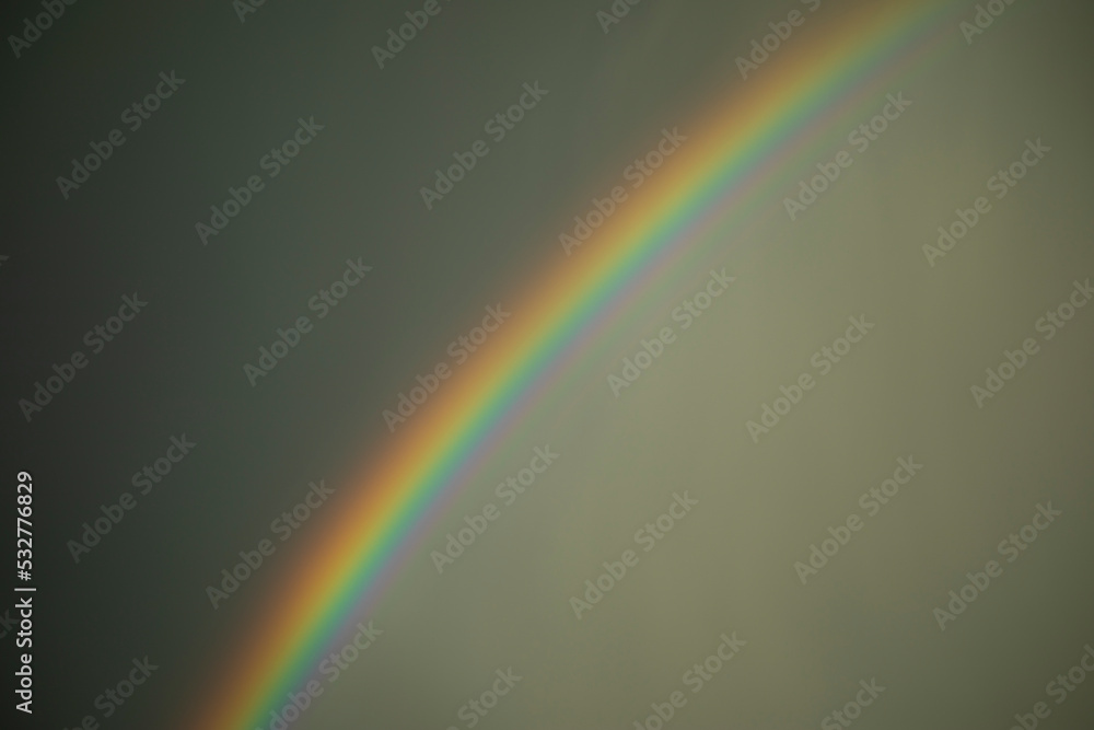 Rainbow in sky. Atmospheric phenomenon. Refraction of light. Rainbow in sky. Atmospheric phenomenon. Refraction of light.