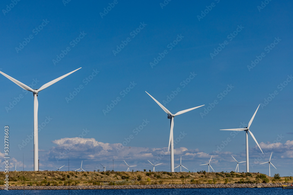 Copenhagen, Denmark Wind turbines in the Oresund straights near the city. Copenhagen, Denmark Wind turbines in the Oresund straights near the city.