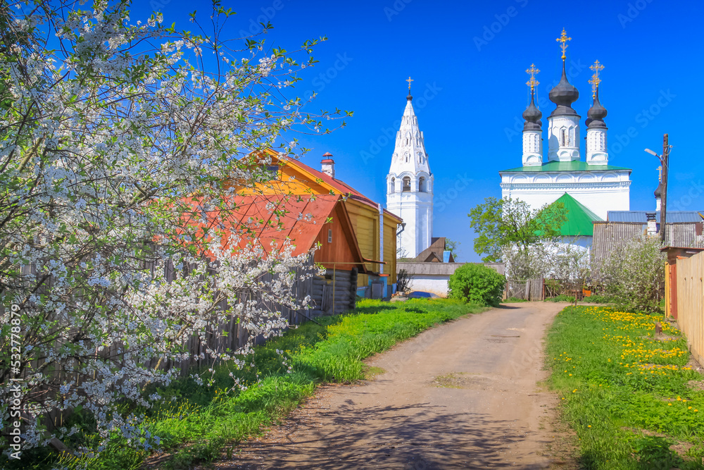Orthodox church at golden sunrise, Suzdal street, Russia