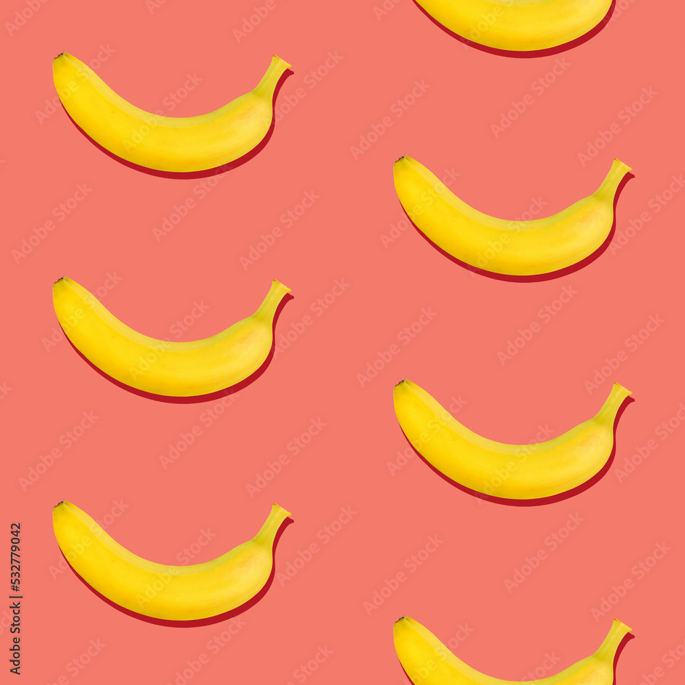 Seamless pattern of bananas on pink background