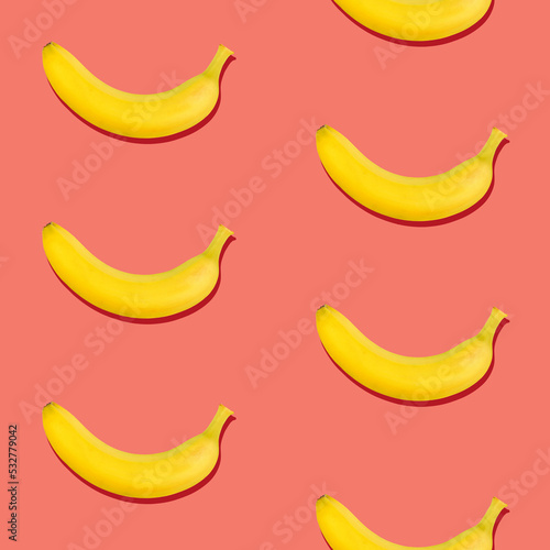 Seamless pattern of bananas on pink background