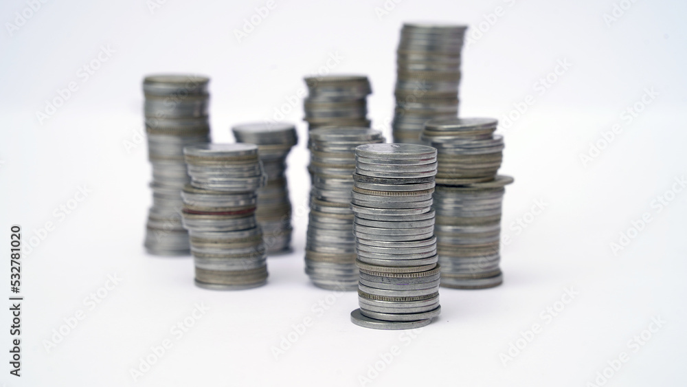 Stack of coins arranged as a graph on white background. Business concept coin investment growth graph display. financial and banking concept. investing economic growing. Stack of coins arranged as a graph on white background. Business concept coin investment growth graph display. financial and banking concept. investing economic growing.