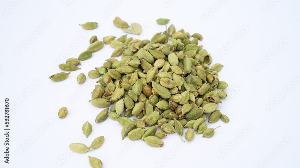 Cardamom pods and seeds isolated on white background. Green cardamom pods isolated on white background with copy space for text or images. Spices, food, cooking concept. Close-up shot. Cardamom pods and seeds isolated on white background. Green cardamom pods isolated on white background with copy space for text or images. Spices, food, cooking concept. Close-up shot.