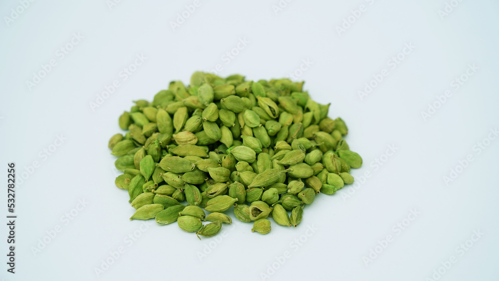 Cardamom pods and seeds isolated on white background. Green cardamom pods isolated on white background with copy space for text or images. Spices, food, cooking concept. Close-up shot. Cardamom pods and seeds isolated on white background. Green cardamom pods isolated on white background with copy space for text or images. Spices, food, cooking concept. Close-up shot.