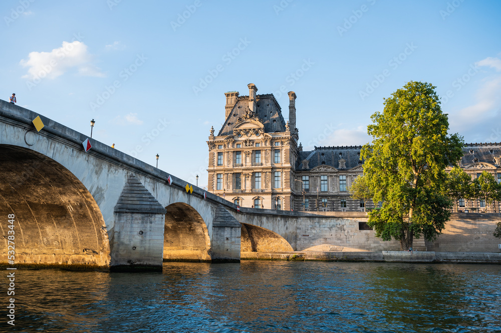 Pont Royal, five-arch bridge over river Seine in Paris, the third oldest bridge in Paris. View from the boat, evening light