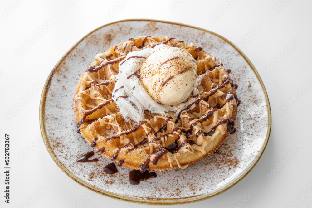 Churros Waffle with chocolate served in a dish isolated on grey background top view Churros Waffle with chocolate served in a dish isolated on grey background top view