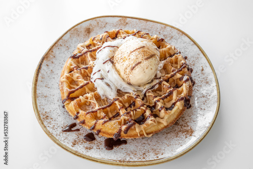 Churros Waffle with chocolate served in a dish isolated on grey background top view