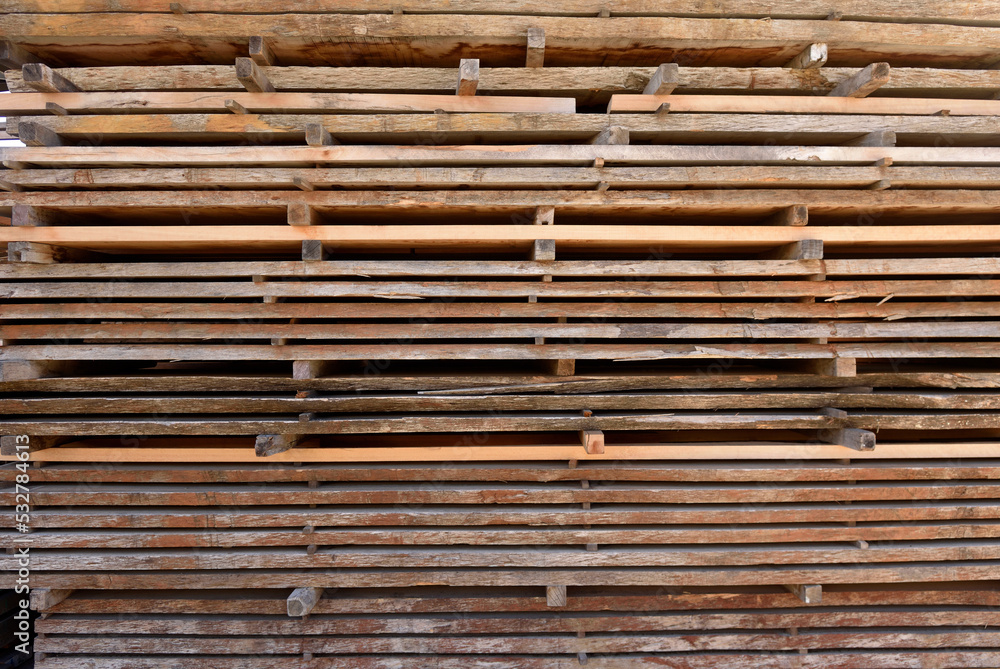 wood boards piled up in the warehouse of a carpentry wood boards piled up in the warehouse of a carpentry