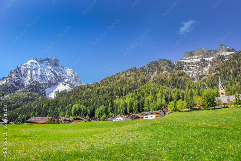 Fototapeta premium Village near Cortina D Ampezzo and alpine meadows with Dolomites alps, Italy