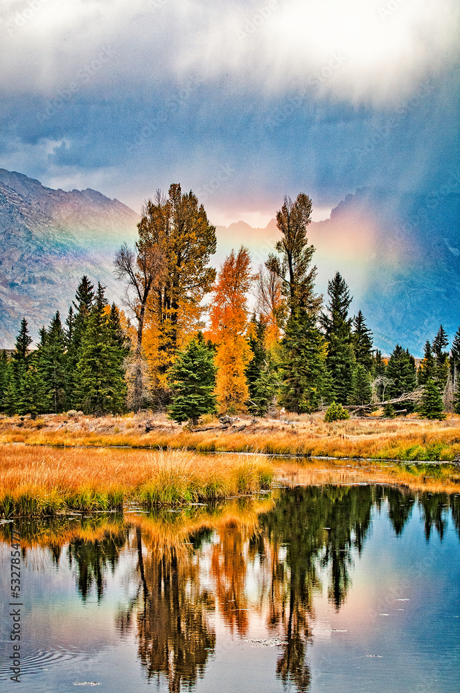 Rainbow and fall foliage at Schwabacher Landing in Grand Teton National Park, Wyoming