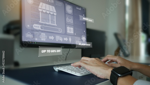 Young woman shopping online by looking through a 3D hologram screen,