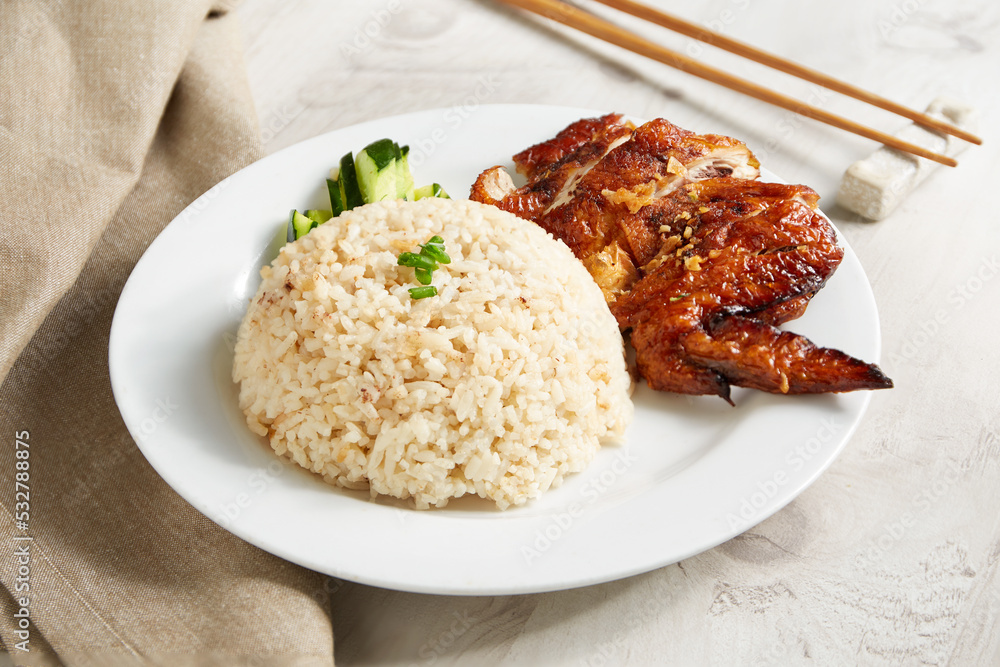 Delicious Malaysia chicken rice. Asian style Hainan chicken rice close-up. Asian food. Delicious Malaysia chicken rice. Asian style Hainan chicken rice close-up. Asian food.