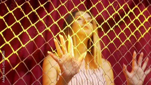Girl dancing in a nightclub in the iron cage. Camera movement