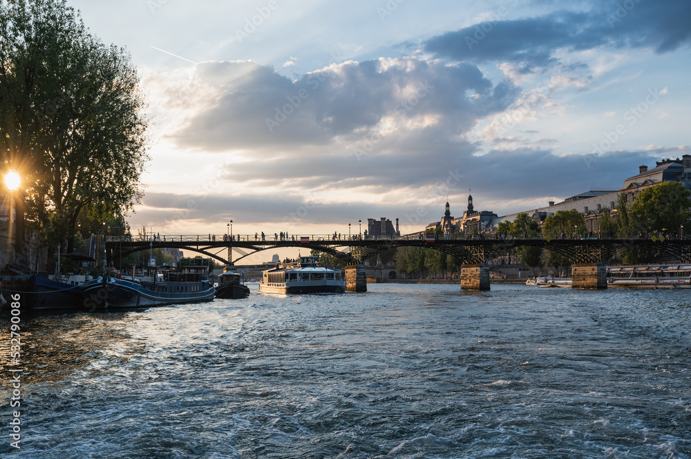 Fototapeta premium Sunset at Pont des Arts, Paris, France or Passerelle des Arts is a pedestrian bridge that has an international reputation as the bridge of romance.