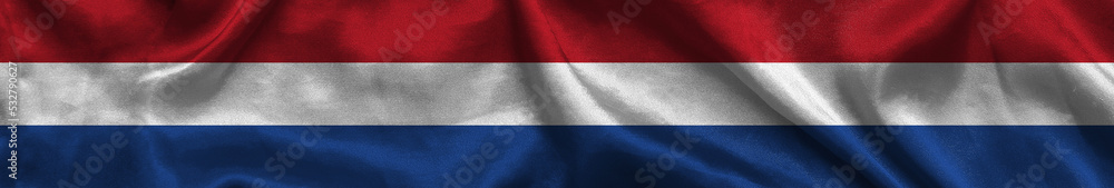 Elongated national flag of Netherlands with a fabric texture fluttering in the wind. Dutch flag for website design. 3d illustration Elongated national flag of Netherlands with a fabric texture fluttering in the wind. Dutch flag for website design. 3d illustration