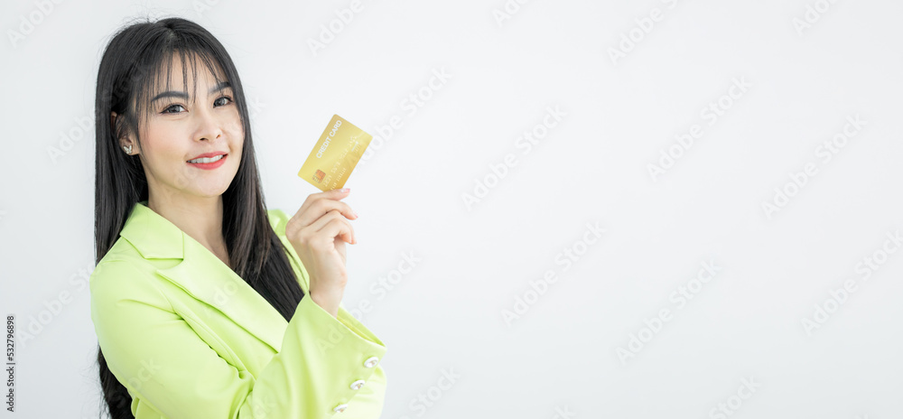 Beautiful Asian woman holding credit card on white background, Asian woman smiling showing presenting credit card, Woman holding bank business credit card, copy space. Beautiful Asian woman holding credit card on white background, Asian woman smiling showing presenting credit card, Woman holding bank business credit card, copy space.