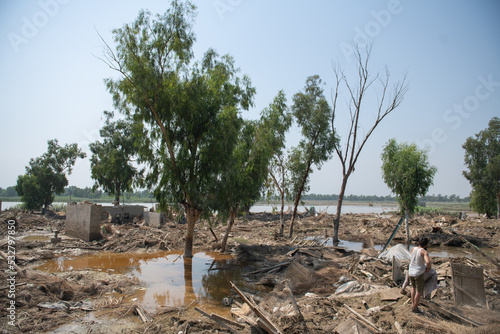 After flood scene of village, people are trying to find their items and valuables
