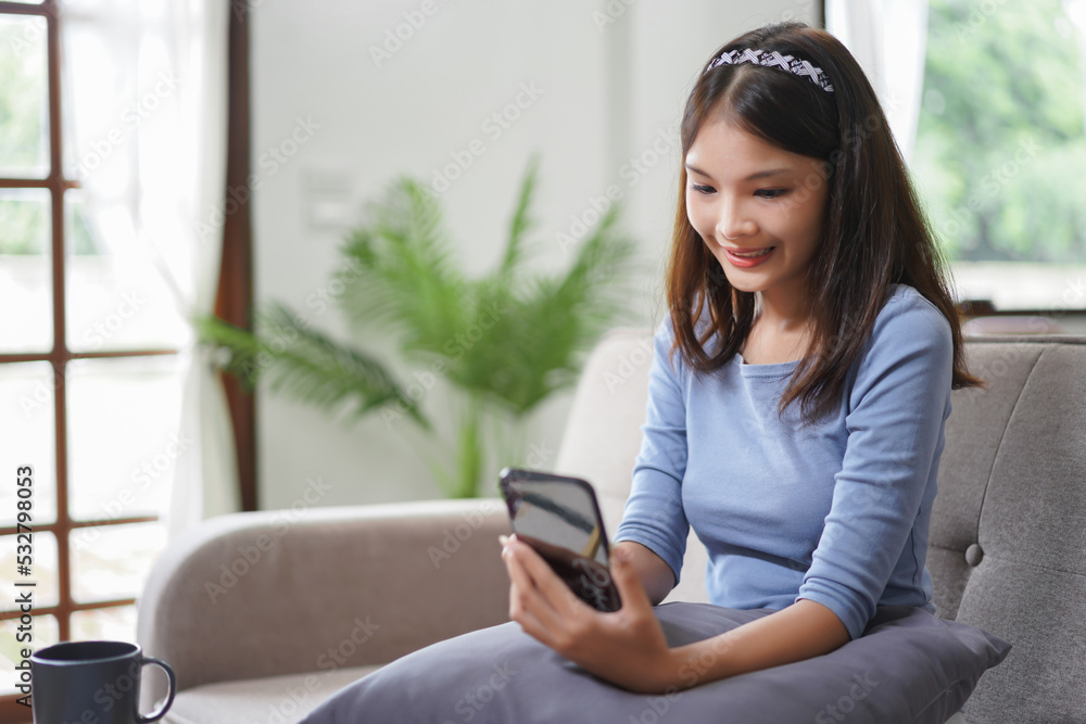 Work from home concept, Business women use smartphone to search data while working remotely at home