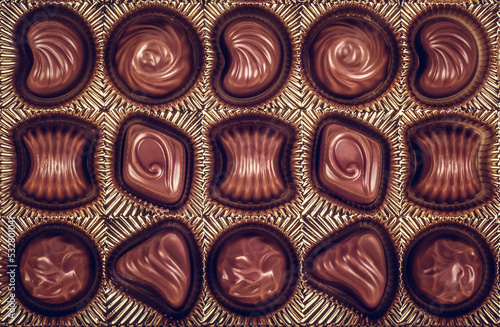 Obraz na płótnie Box Milk Chocolates top view. Box with delicious chocolate candies w salonie