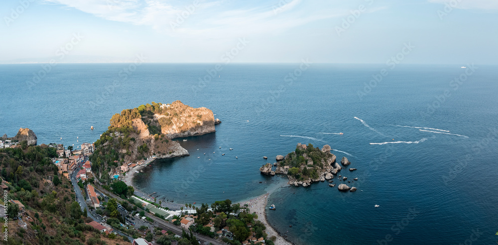 Panoramic view of beautiful landscape by Mediterranean sea. Scenic seascape and coastal city with sky in background. Picturesque scene of nature and urban land.