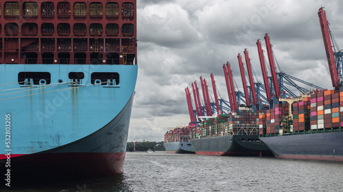 Obraz na płótnie Maritime transport: panorama view of container port terminal in Hamburg (Germany) with loaded cargo container ships (Ultra Large Container Vessel - ULCV) and gantry cranes w salonie