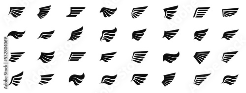 Wings icons set. Set of black wings icons. Wings badges. Set of wings icons. Simple set of wings vector icons. Vector illustration