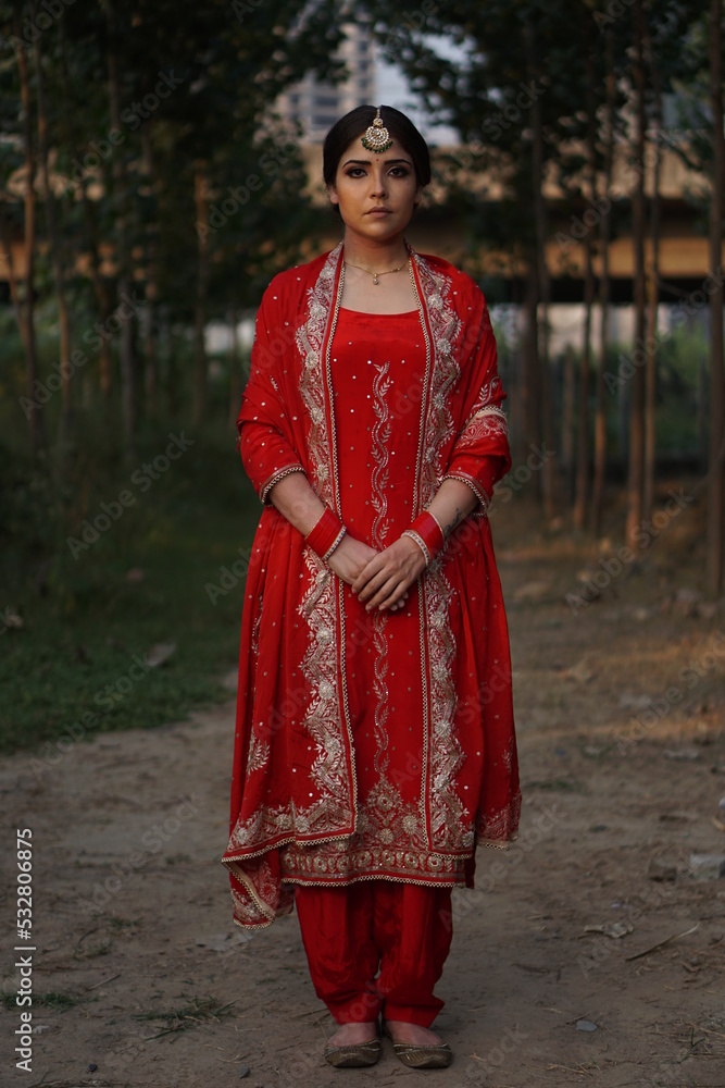 girl wearing red suit and fire in backdrop