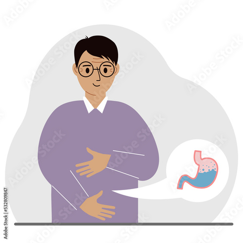 The concept of a healthy stomach. The man holds her stomach with both hands. A healthy stomach or proper digestion.