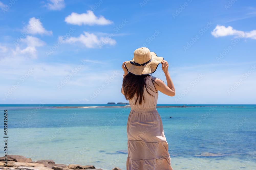 Travel woman go to the beach in Penghu of Taiwan