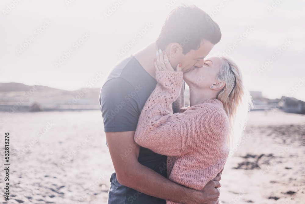 Couple kissing outdoor with love in relationship. Dating and vacation