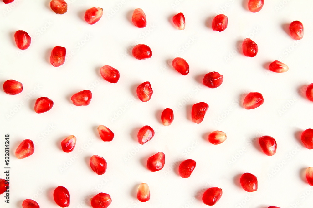 juicy fresh pomegranate seeds isolated on white background,Top view flat lay pattern,selective focus juicy fresh pomegranate seeds isolated on white background,Top view flat lay pattern,selective focus