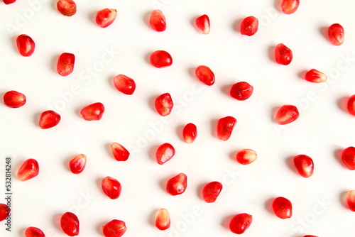 juicy fresh pomegranate seeds isolated on white background,Top view flat lay pattern,selective focus