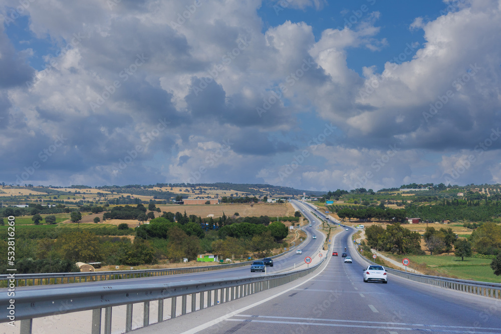 Highway wide road, transport and blue sky with clouds on a summer day Highway wide road, transport and blue sky with clouds on a summer day