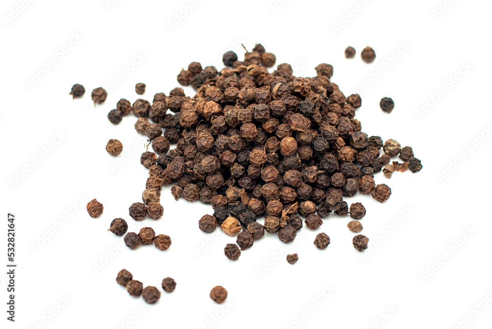Black pepper, spice close-up flat lay on a white background. Indian and Arabic spices for cooking. Medicinal herbs and spices. Black pepper, spice close-up flat lay on a white background. Indian and Arabic spices for cooking. Medicinal herbs and spices.