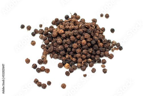 Black pepper, spice close-up flat lay on a white background. Indian and Arabic spices for cooking. Medicinal herbs and spices.