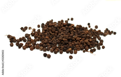 Black pepper, spice close-up flat lay on a white background. Indian and Arabic spices for cooking. Medicinal herbs and spices.