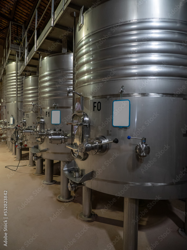 Stainless steel wine fermentation containers in a winery, Spain