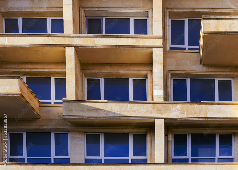 wall with windows in the style of teal orange stone with balconies is good for a background without people wall with windows in the style of teal orange stone with balconies is good for a background without people