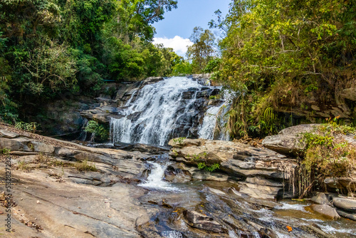 Fototapeta Naklejka Na Ścianę i Meble -  Waterfall with beautiful rocks and splashing water in Thailand