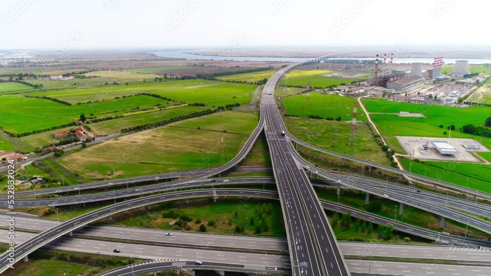 aerial view of intersection outside of Lisbon with viaducts and intersections with traffic summer. Portugal 4k aerial view of intersection outside of Lisbon with viaducts and intersections with traffic summer. Portugal 4k