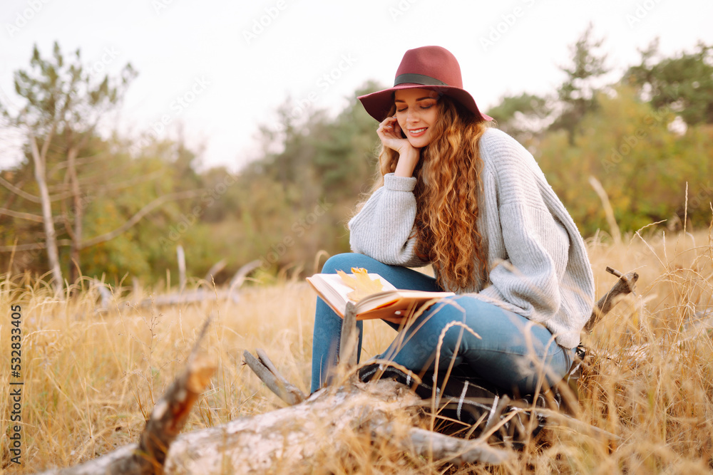 Hello october. Happy trendy woman outdoors in the city park in autumn. Fashion, style concept. Hello october. Happy trendy woman outdoors in the city park in autumn. Fashion, style concept.