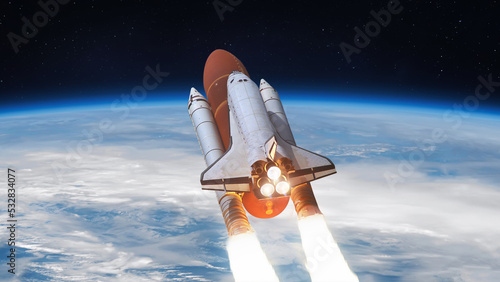 Fototapeta Naklejka Na Ścianę i Meble -  Space shuttle flight in space from Earth. Spaceship in sky. Spacecraft launch. Elements of this image furnished by NASA