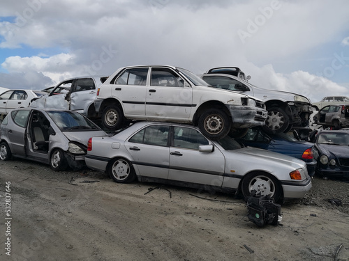 The scrap yard with old cars of crushed cars © Maristos